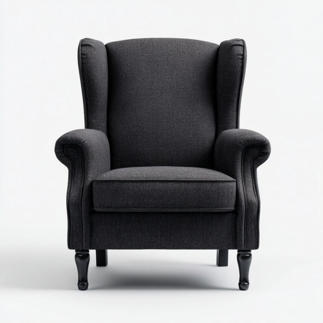 Poltrona ad ala in tessuto grigio scuro con braccioli arrotondati